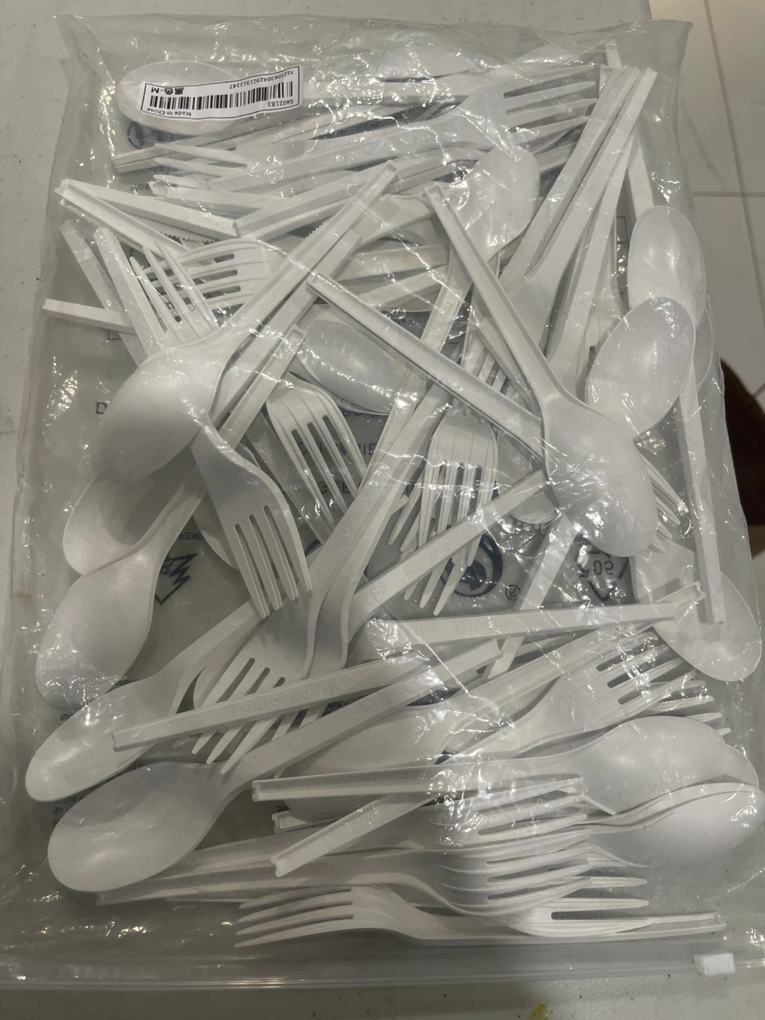 Bag of White Plastic Forks and Spoons