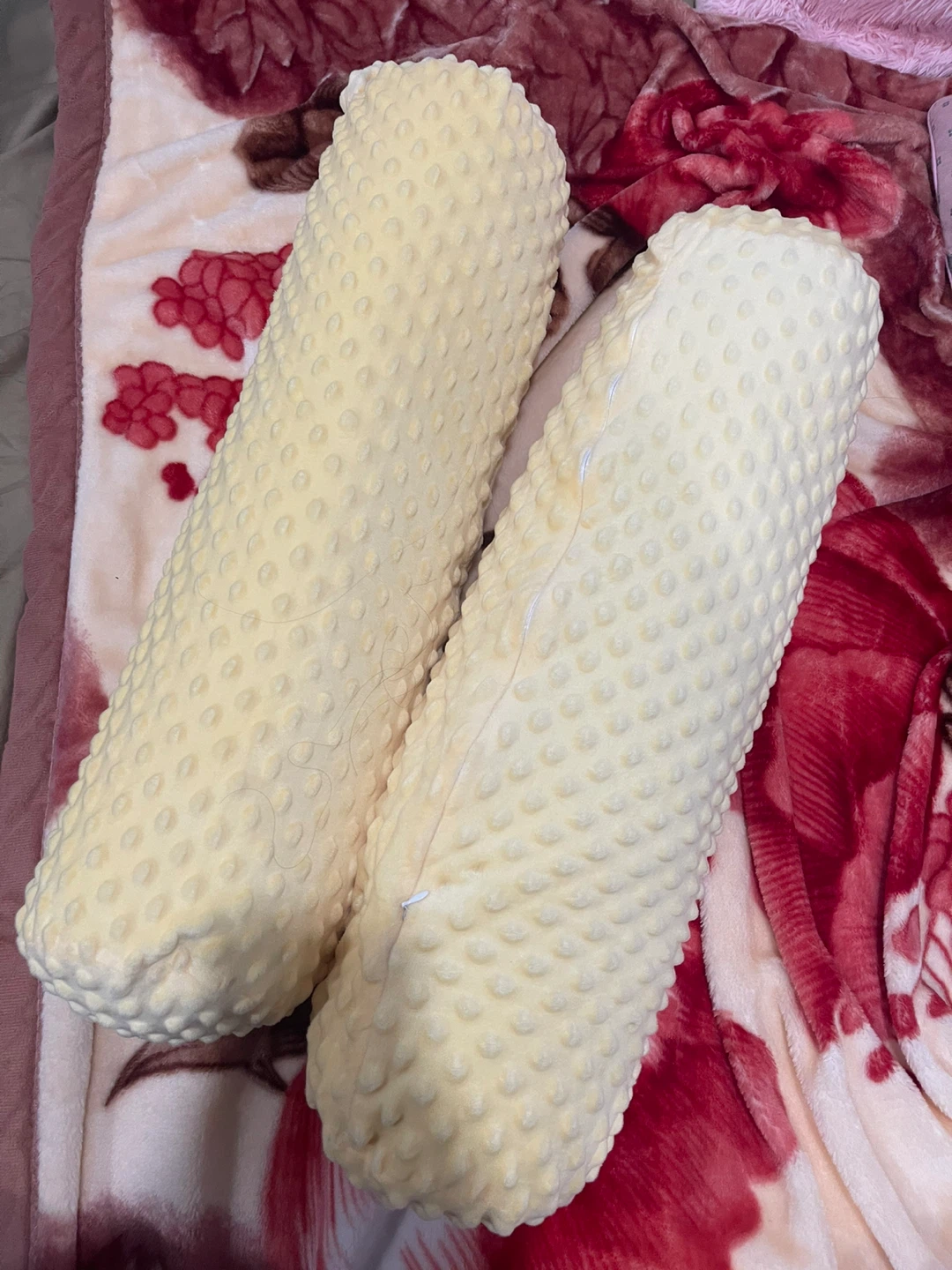 Two yellow bolster pillows