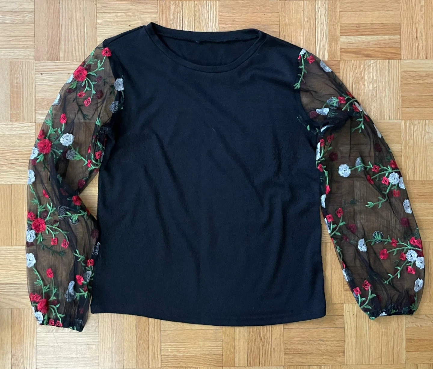 Black top with floral sheer sleeves