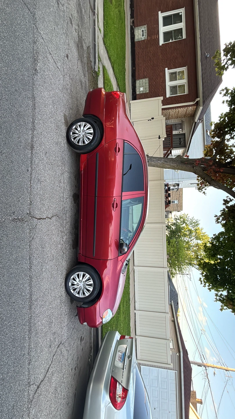 2005 Toyota Corolla Red Sedan 212.000 miles