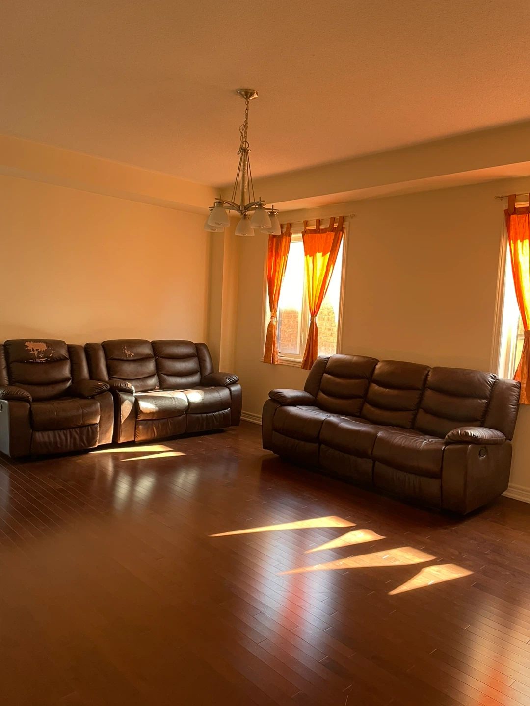 Brown Leather Reclining Sofa and Loveseat Set