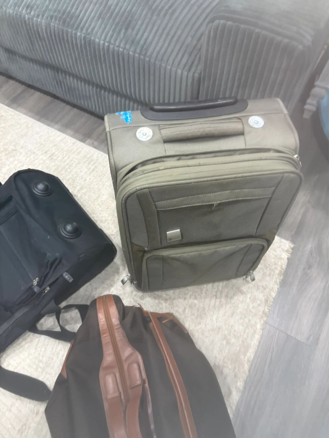 Roots backpack and two suitcases