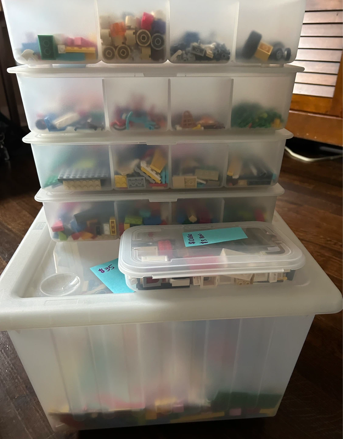 Assorted LEGO building blocks in storage containers