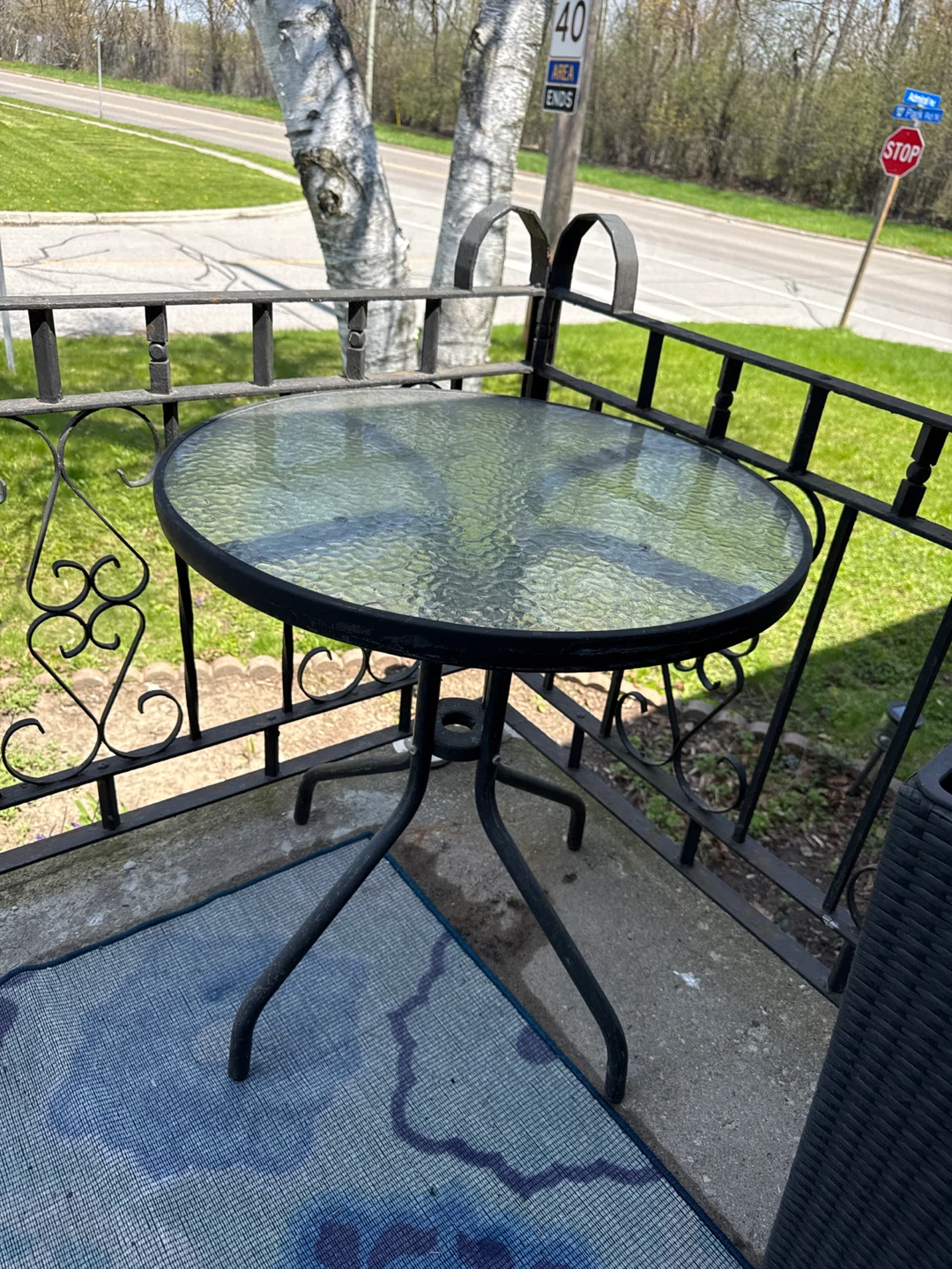 Glass top patio table with metal base