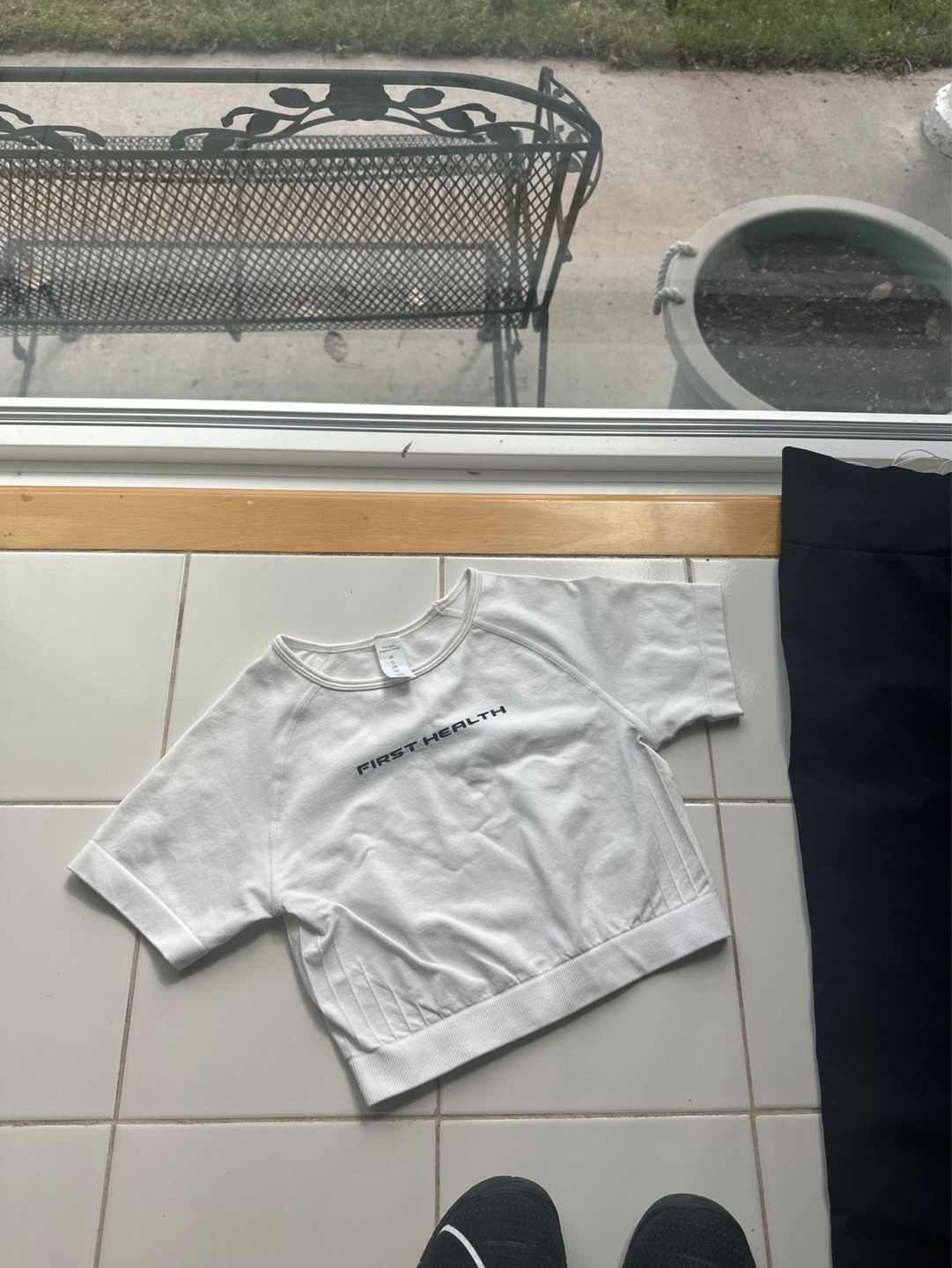 First Health Black Flare Leggings and White Crop Top