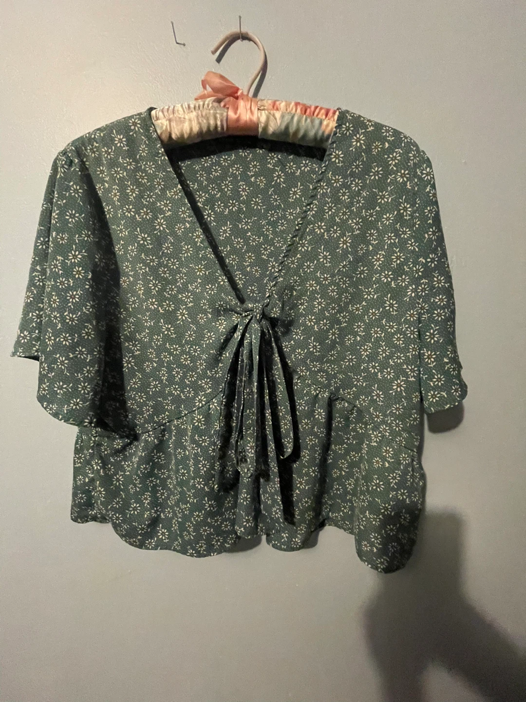 Green floral peplum tie-front blouse
