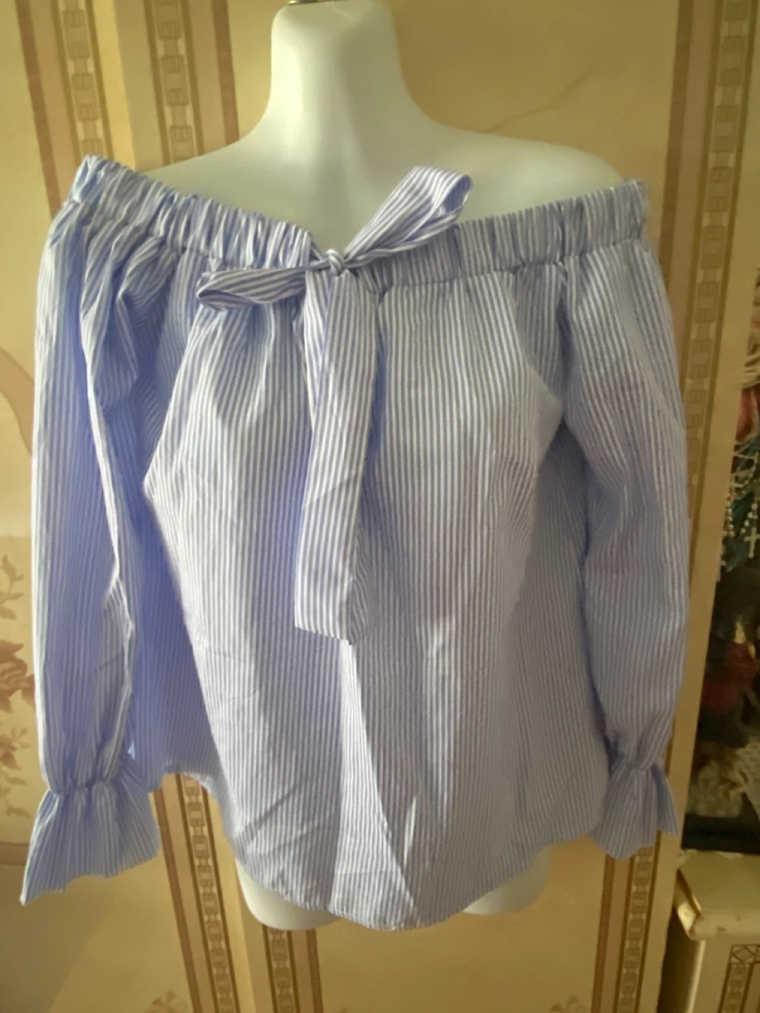Blue and white striped off-the-shoulder blouse