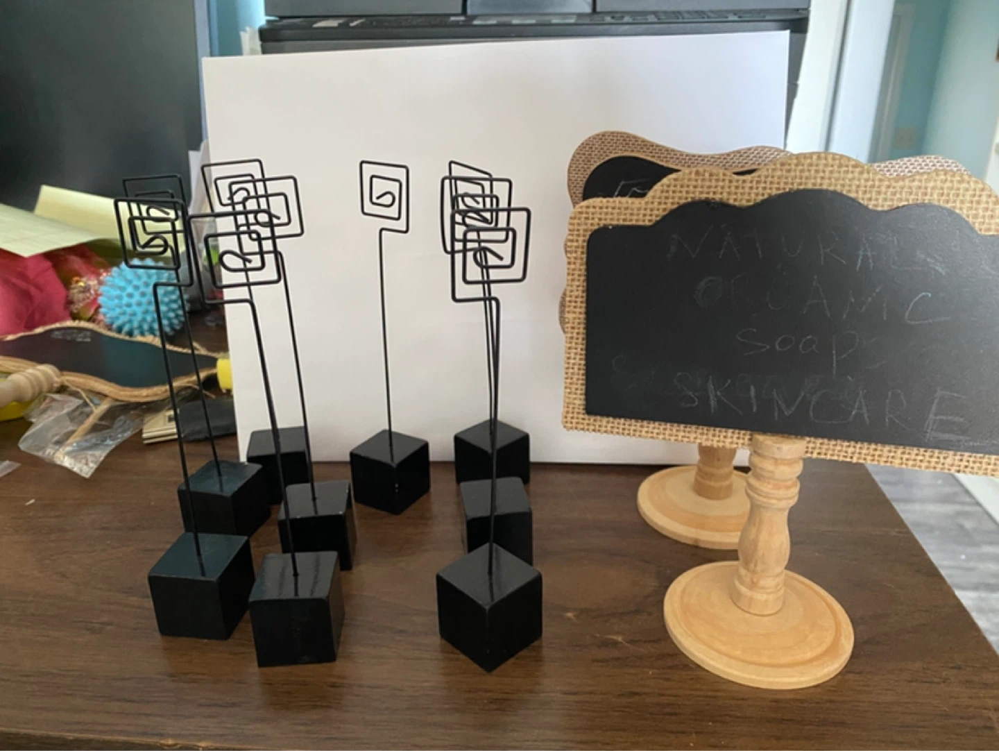 9 Black Wire Place Card Holders plus small blackboard