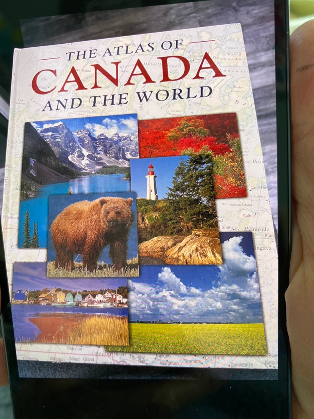The Atlas of Canada and the World in hard cover