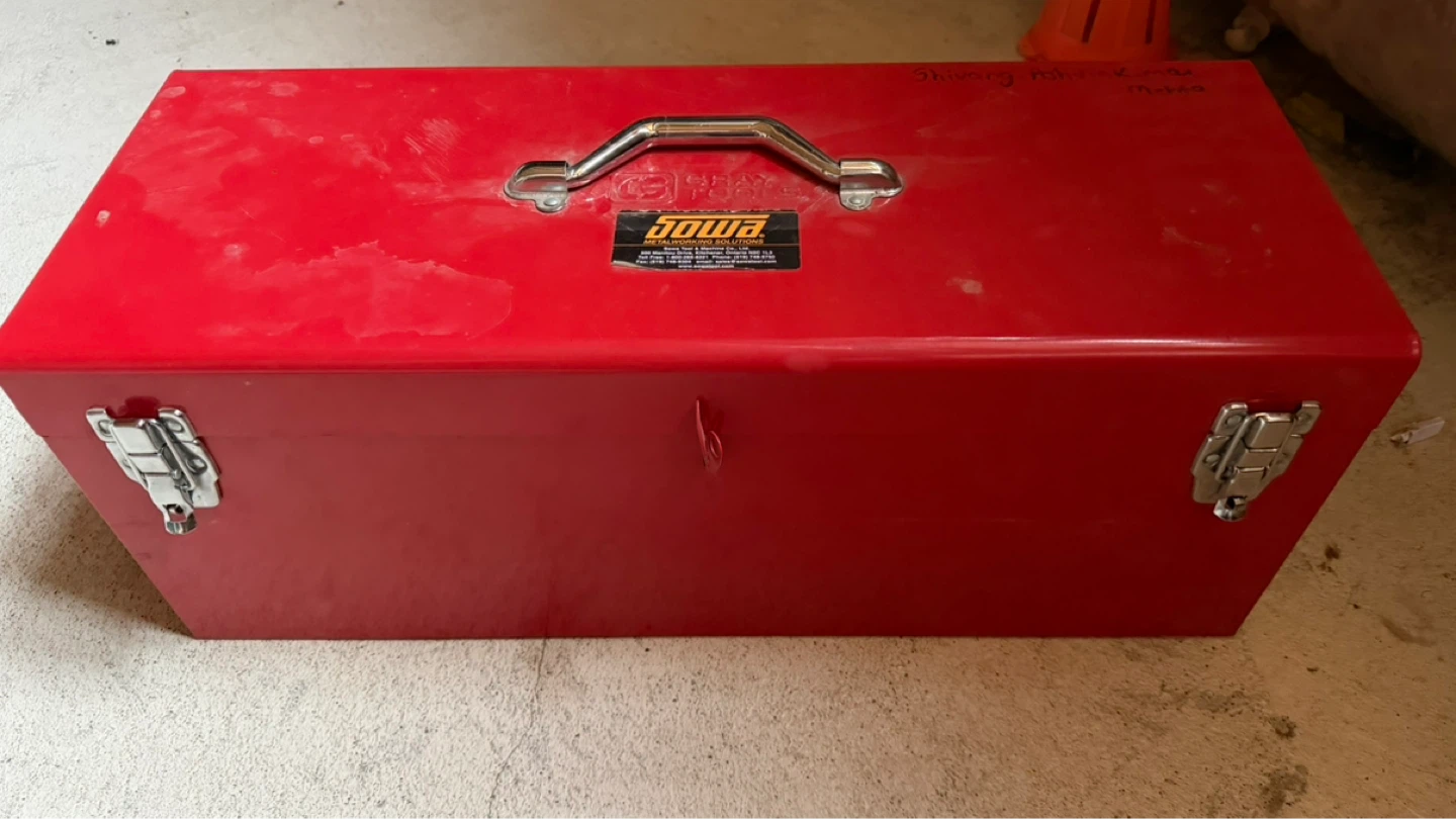 Red Metal Toolbox with Assorted Tools
