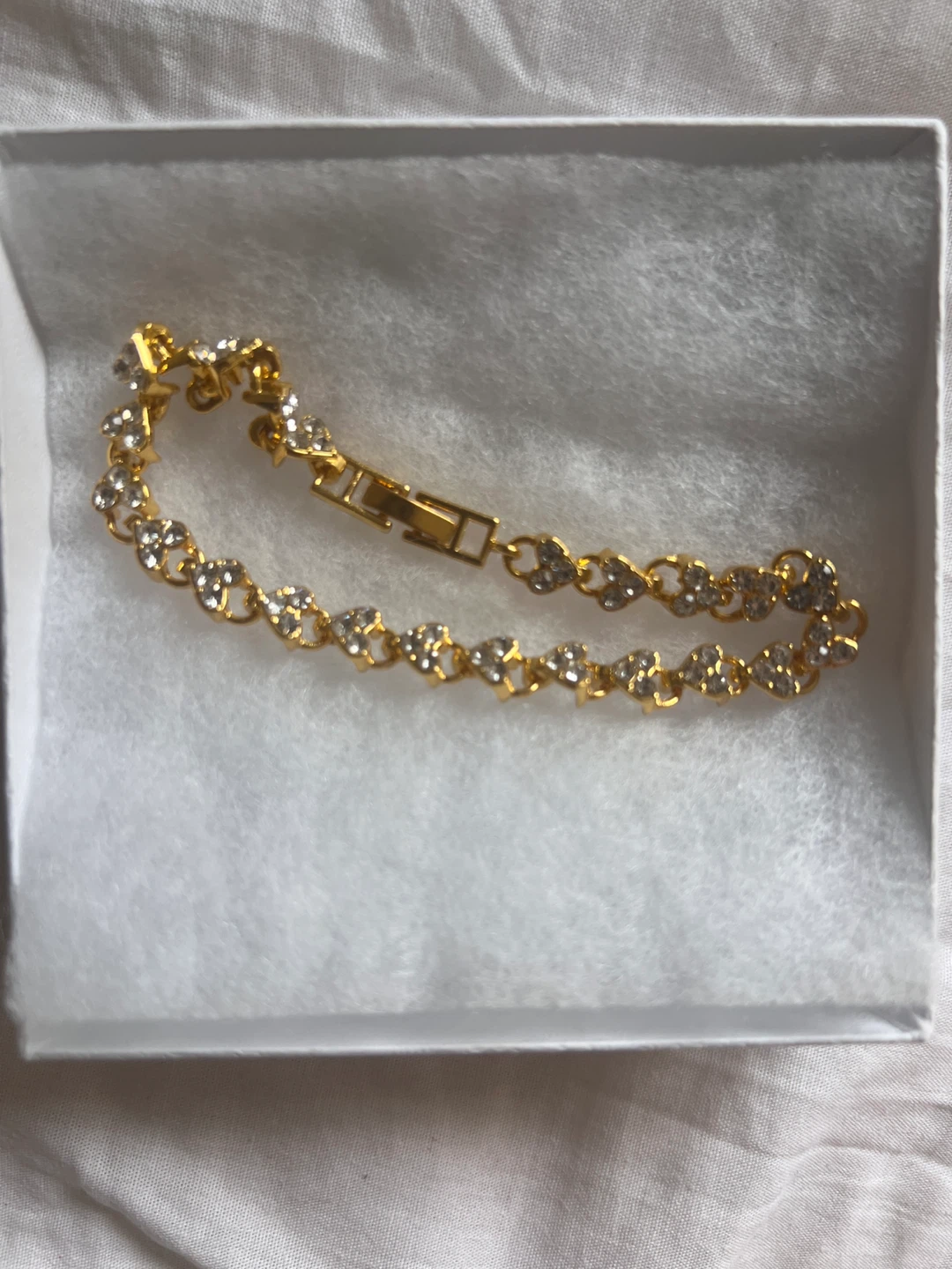 Gold-tone bracelet with clear stones