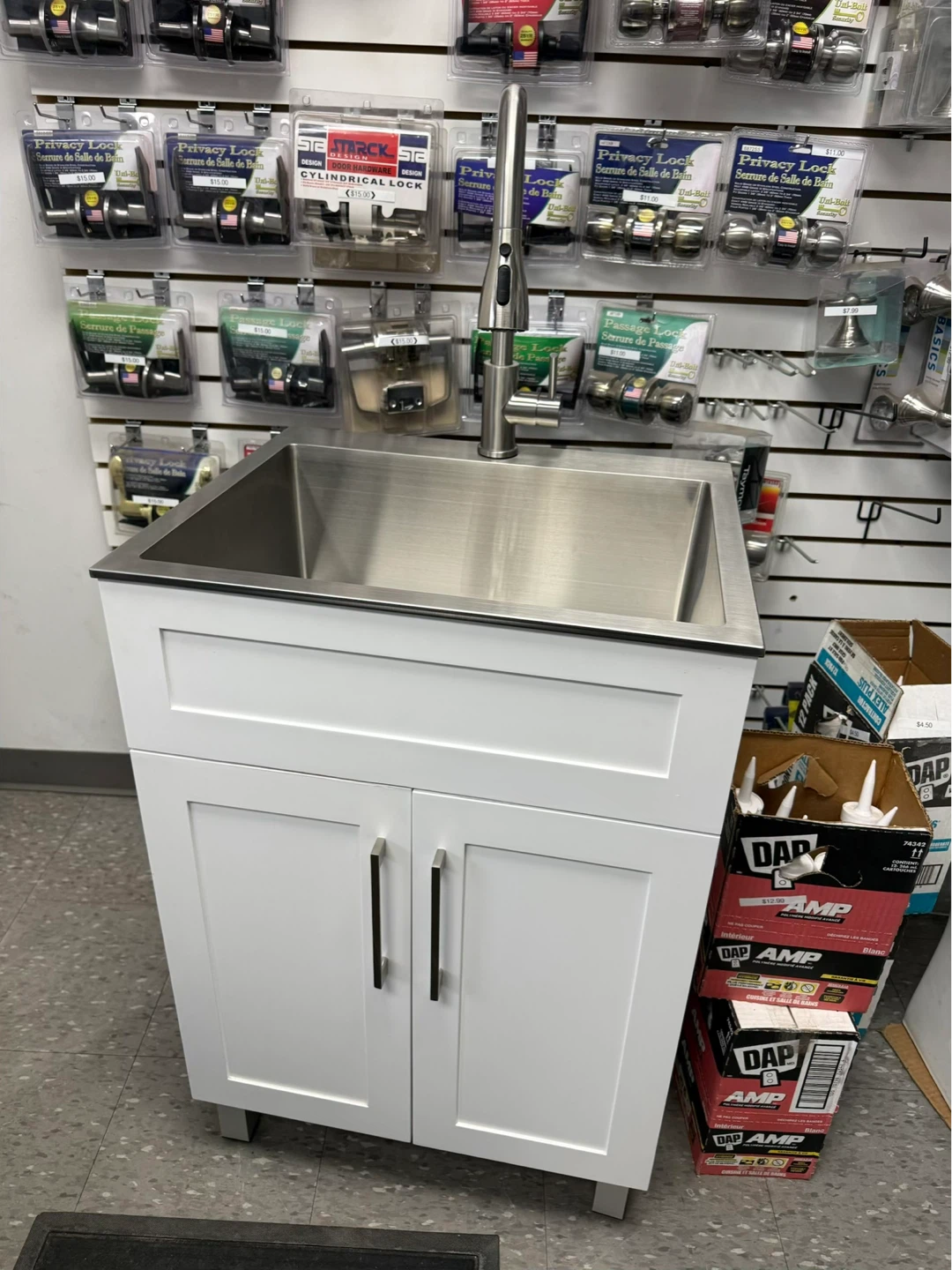 Stainless Steel Sink with White Cabinet and Faucet