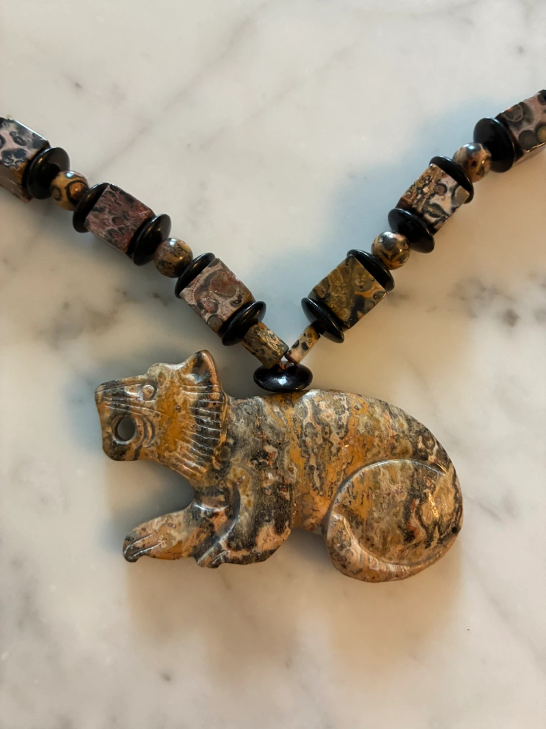 Beaded Necklace with Carved Animal Pendant