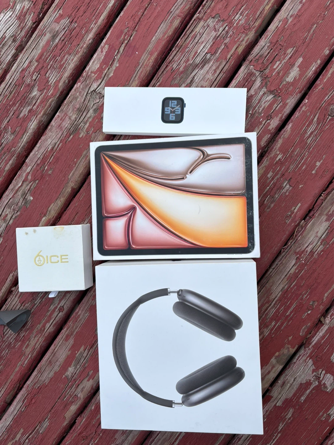 Apple Watch Series 5, iPad Pro, and AirPods Max empty box