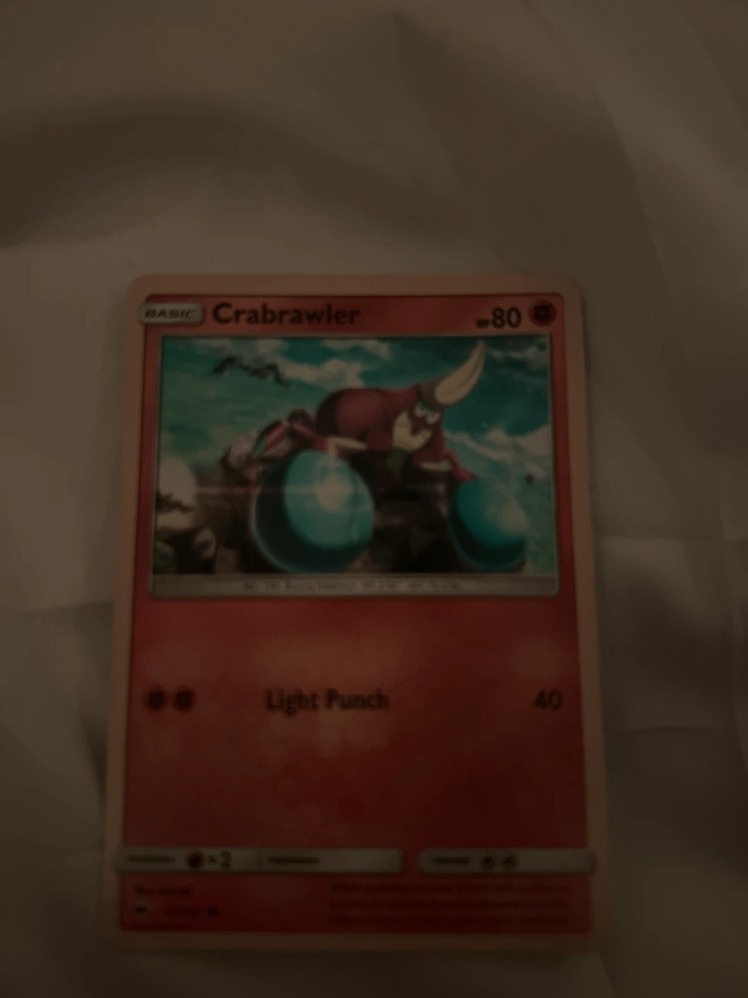 Assorted Pokémon Cards: Crabrawler, Raboot, Voltorb, Onix, Hau