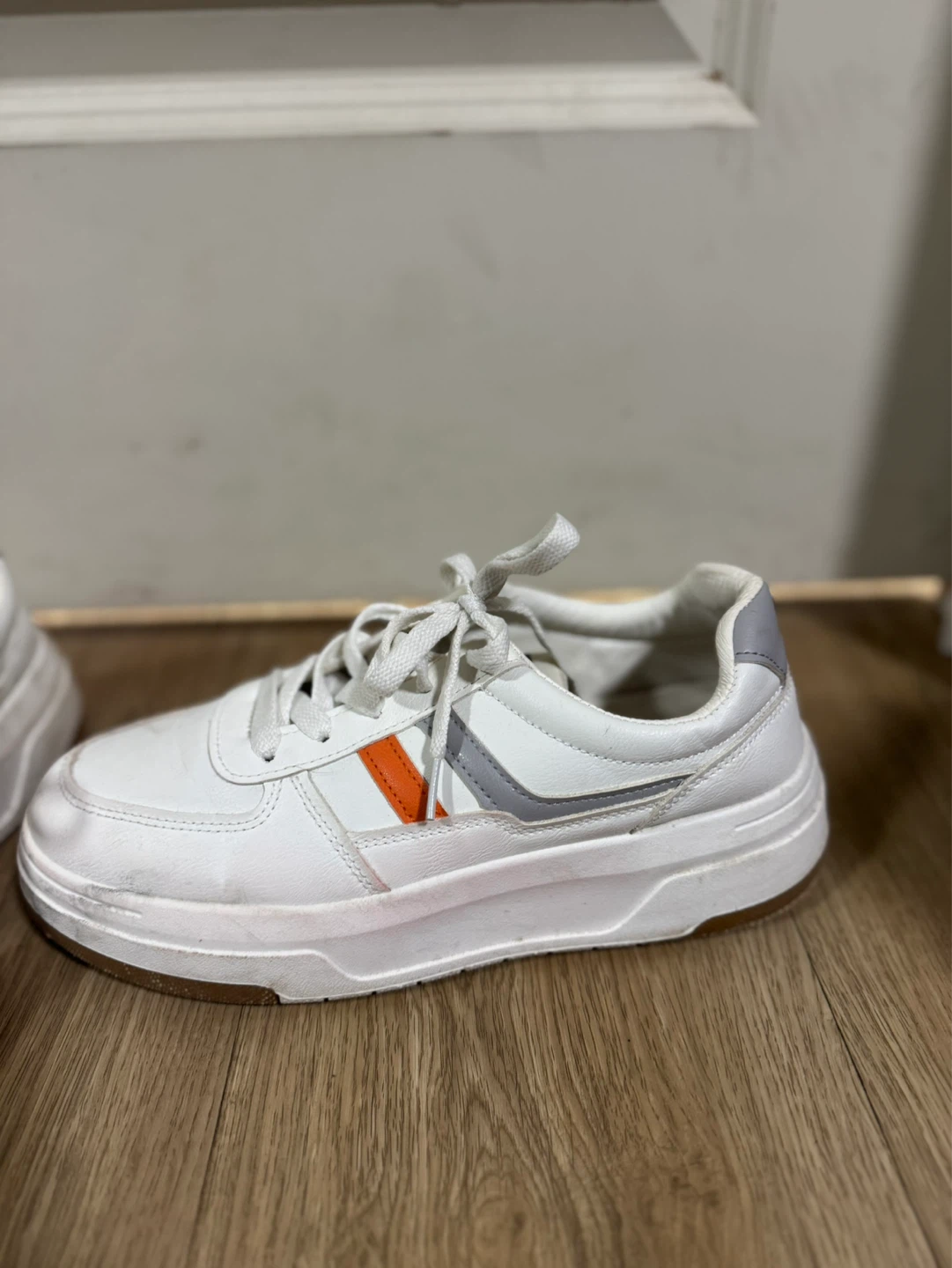 White fashion sneakers with orange and grey stripe accents - photo 2