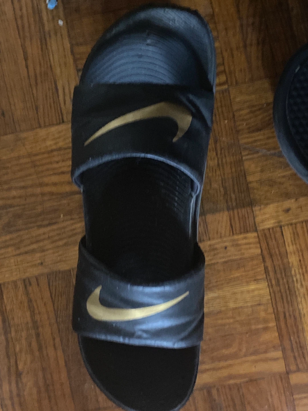 Nike Black and Gold Slides