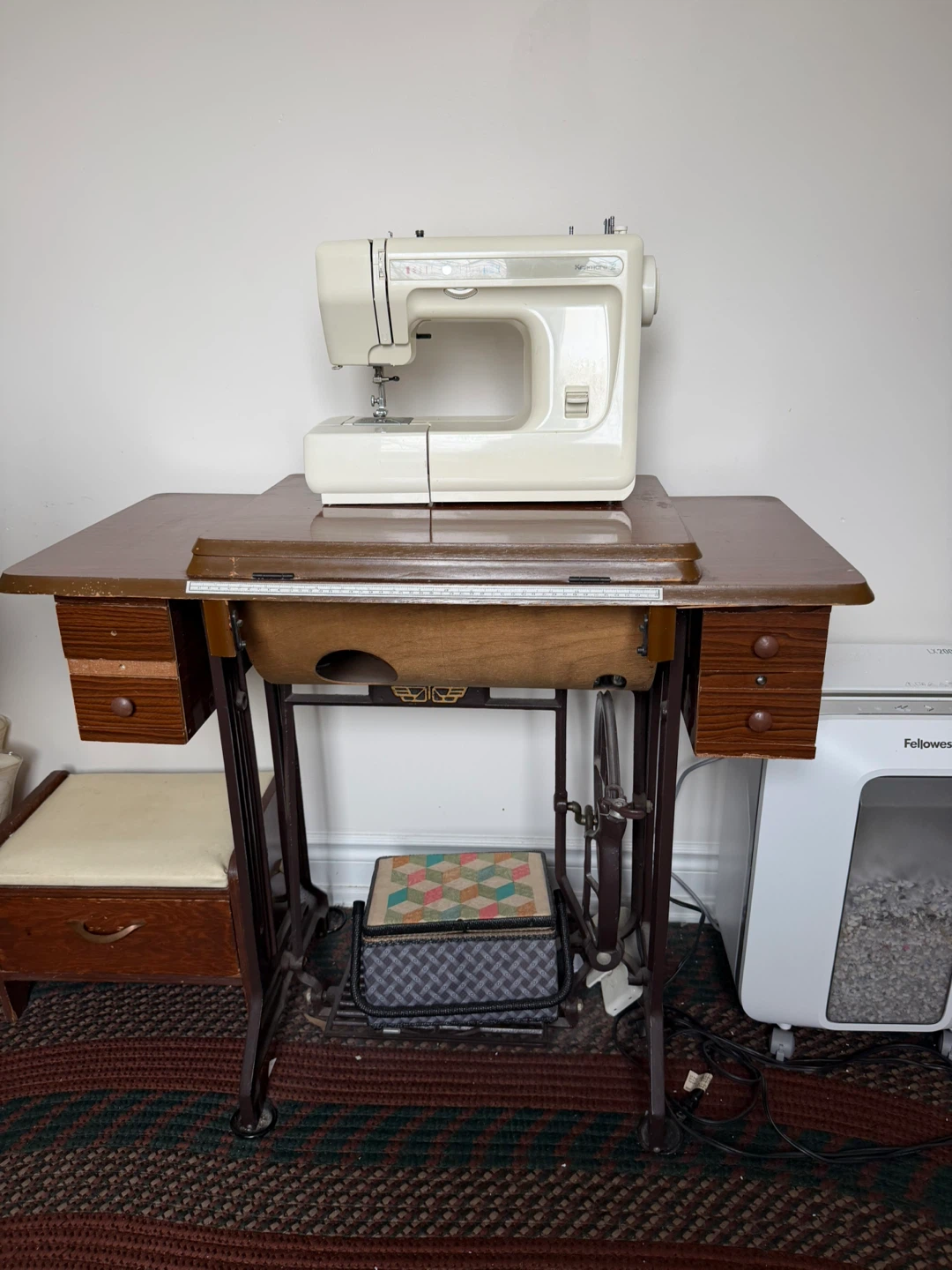 White Kenmore Sewing Machine on Wooden Table