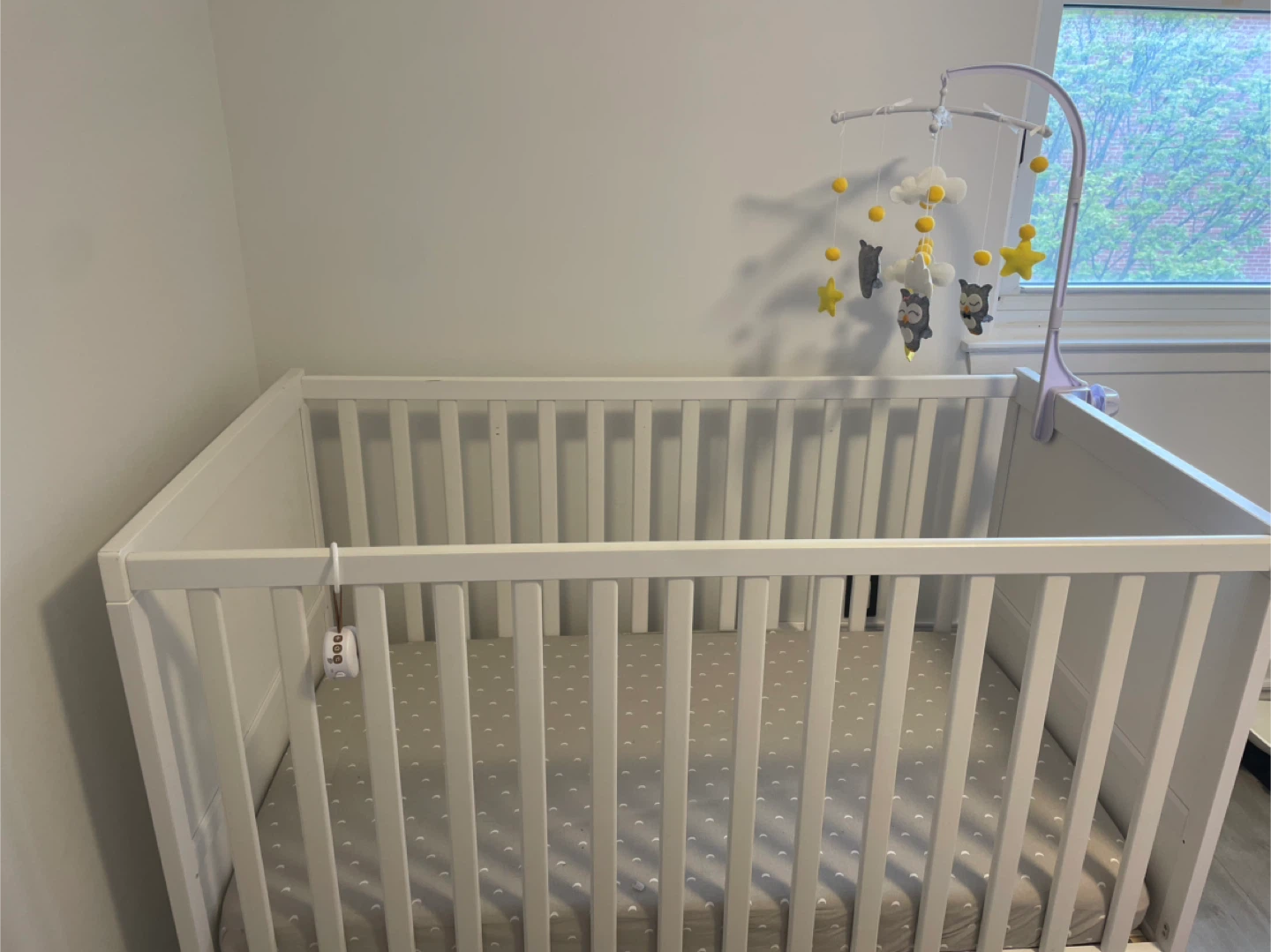 White Baby Crib with Mobile