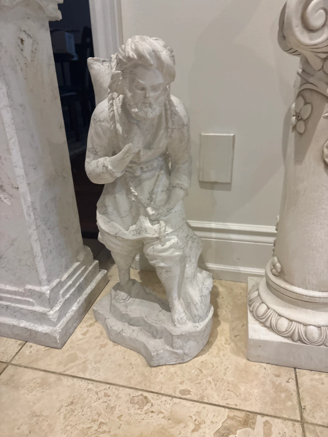 Vintage Statue of Man Carrying Bundle