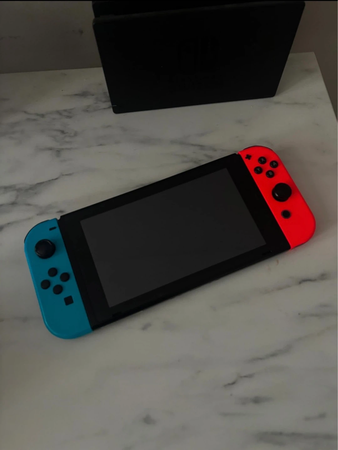 Nintendo Switch Console with Neon Red and Blue Joy-Cons