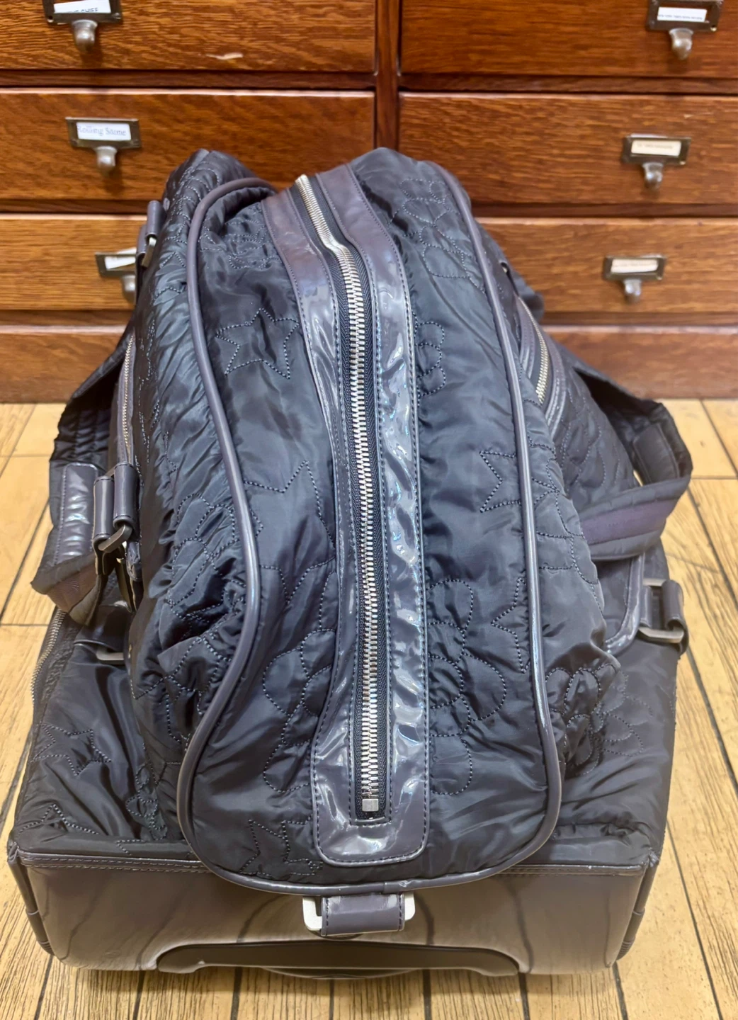 Black Quilted Rolling Duffel Bag with Telescoping Handle - photo 3