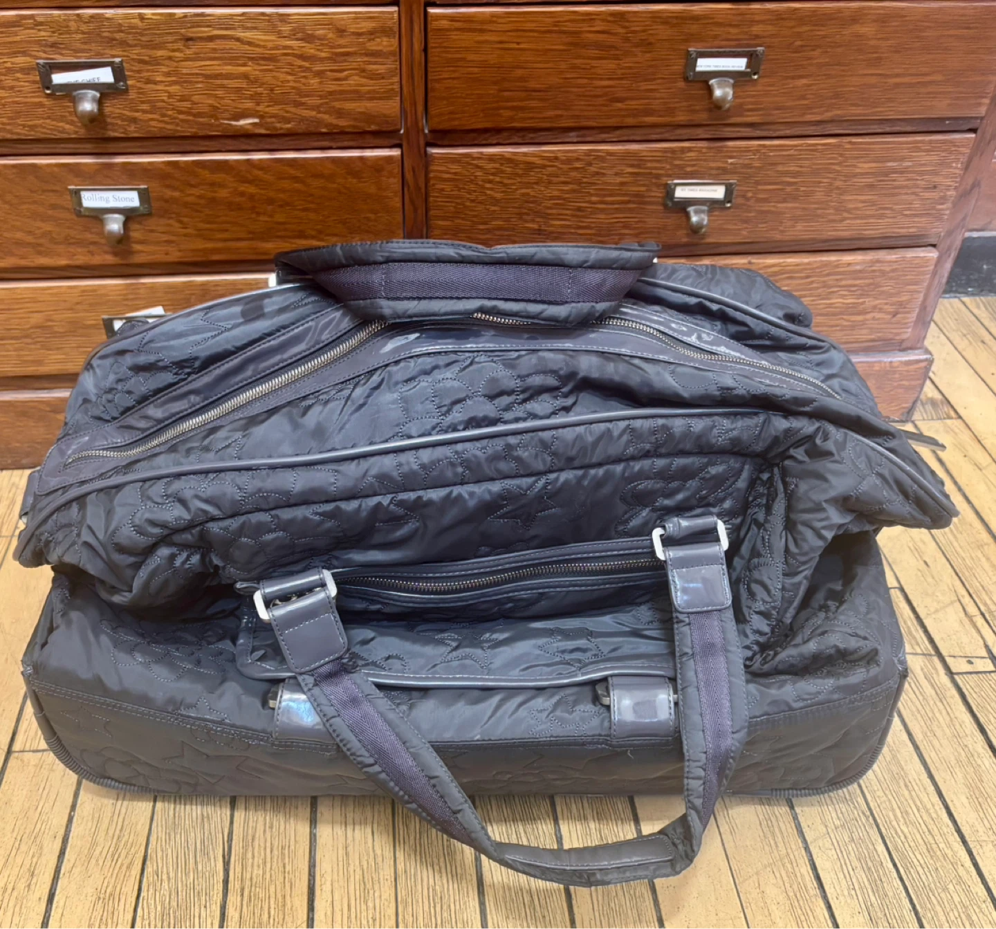 Black Quilted Rolling Duffel Bag with Telescoping Handle - photo 2