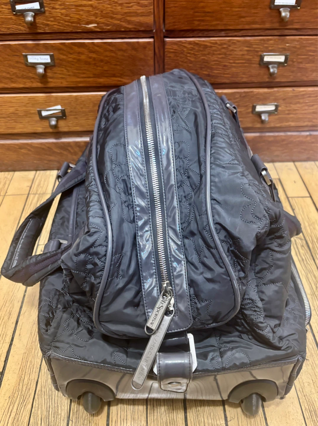 Black Quilted Rolling Duffel Bag with Telescoping Handle
