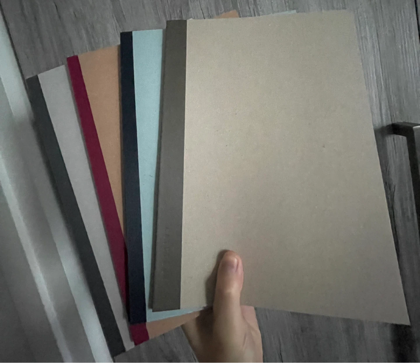 Assorted coloured blank notebooks