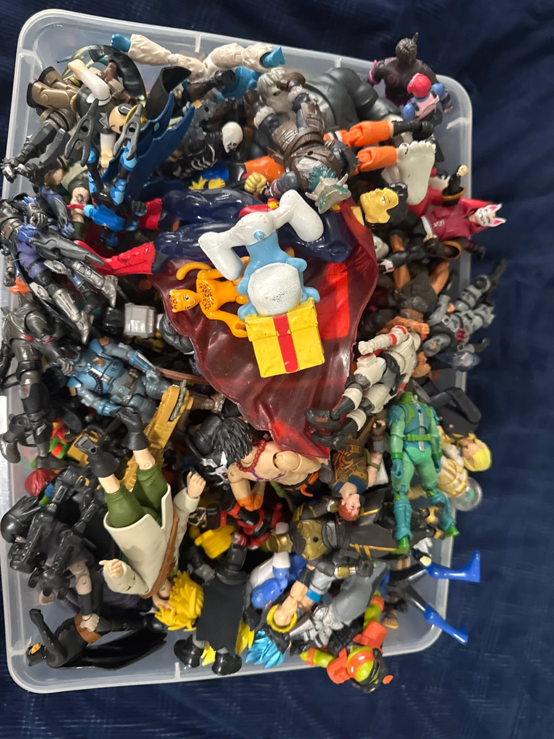 Assorted Lot of Action Figures in Storage Bin