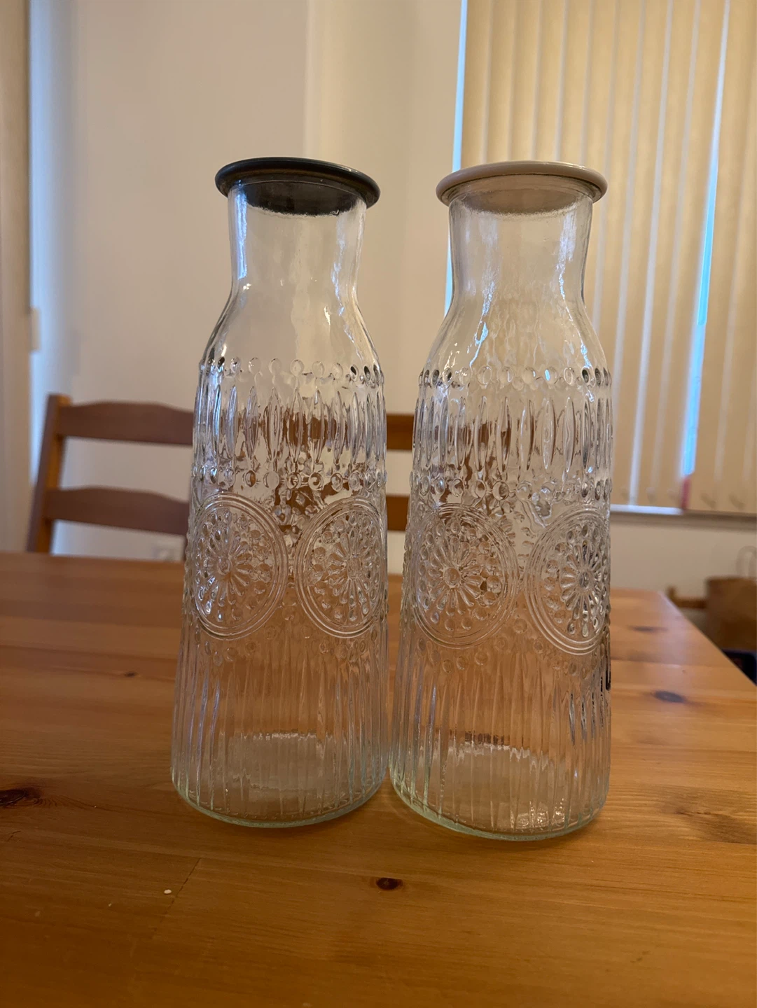 Set of 2 Embossed Glass Bottles with Lids