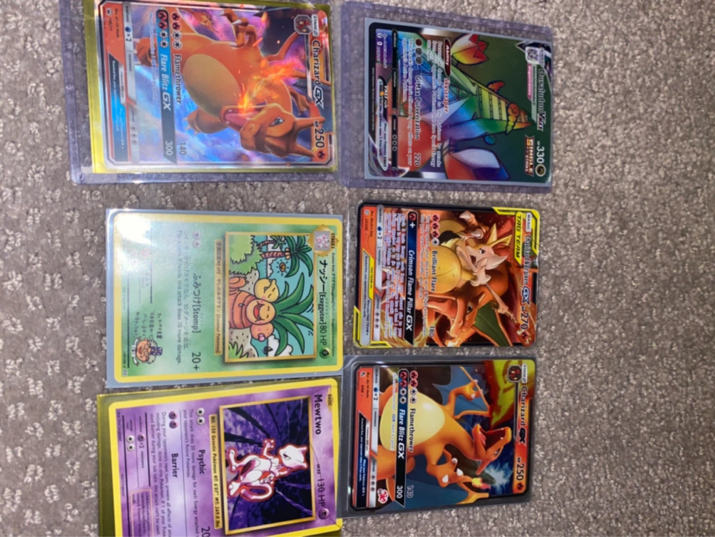 Pokemon Cards Charizard GX, Duraludon VMAX, Mewtwo, and more