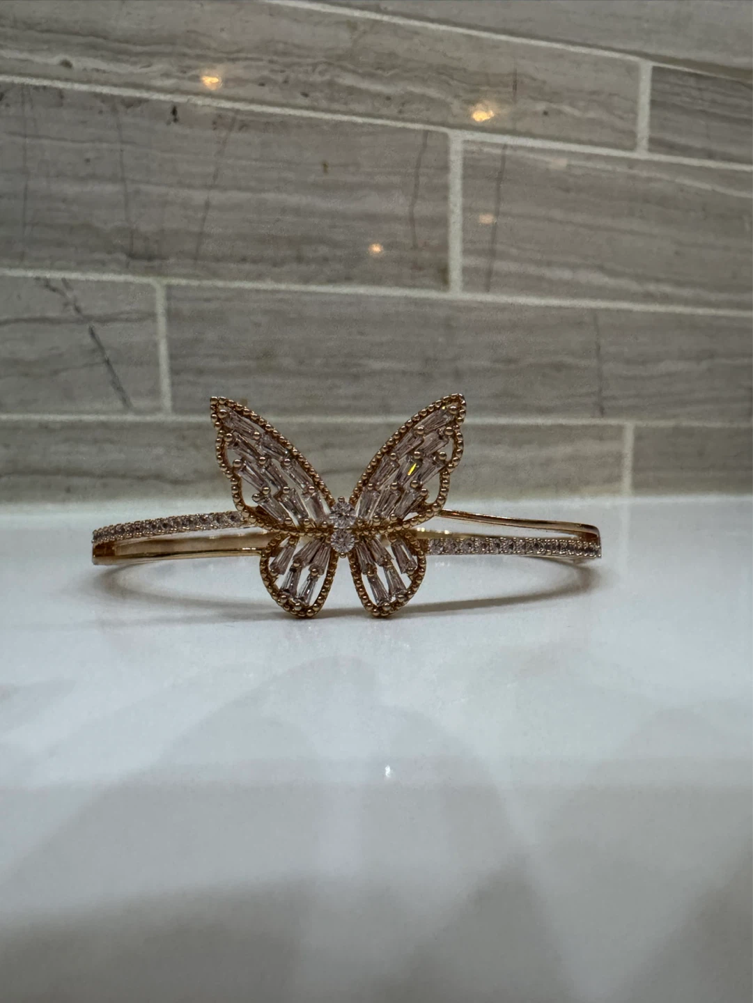 Gold tone butterfly bangle bracelet