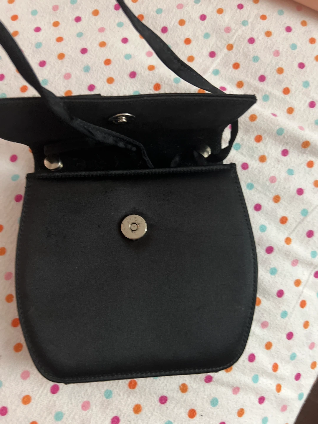 Black satin clutch purse with flower detail