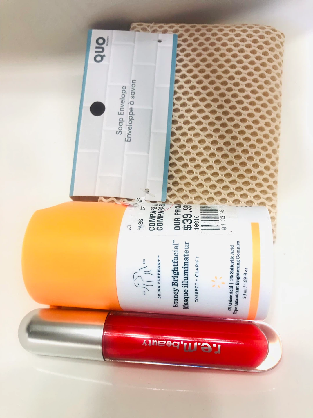 Lot: Drunk Elephant Brightfacial + R.E.M. Lip Oil