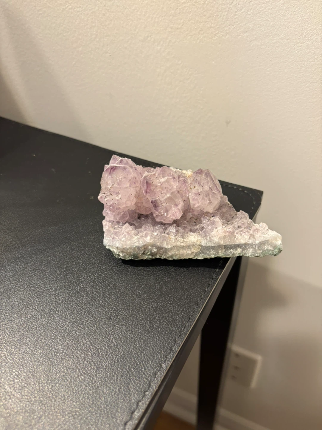 White crystal with a bit purple color in tip