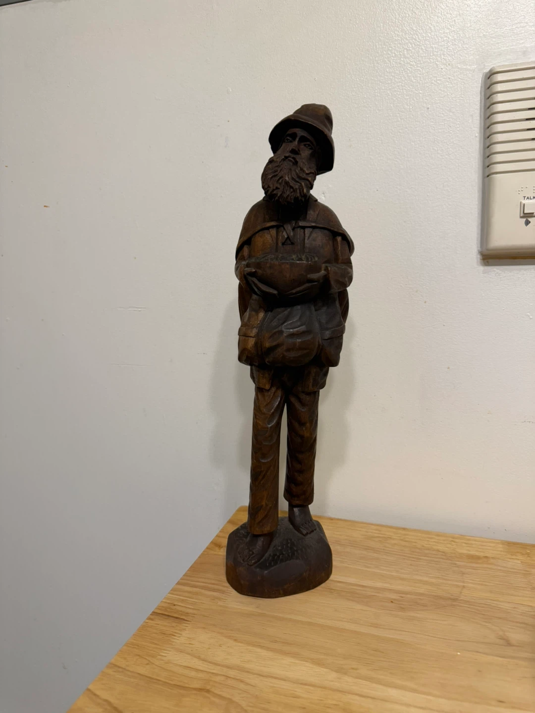 Vintage Hand Carved Wooden Figurine of a Man with Bags