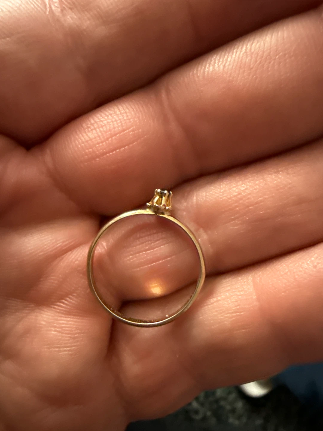 Gold-tone ring with dark stone