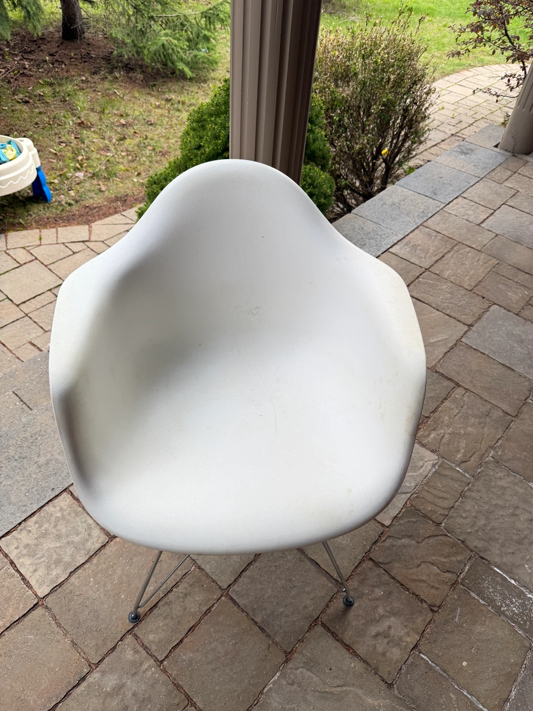 White molded shell chair with chrome legs