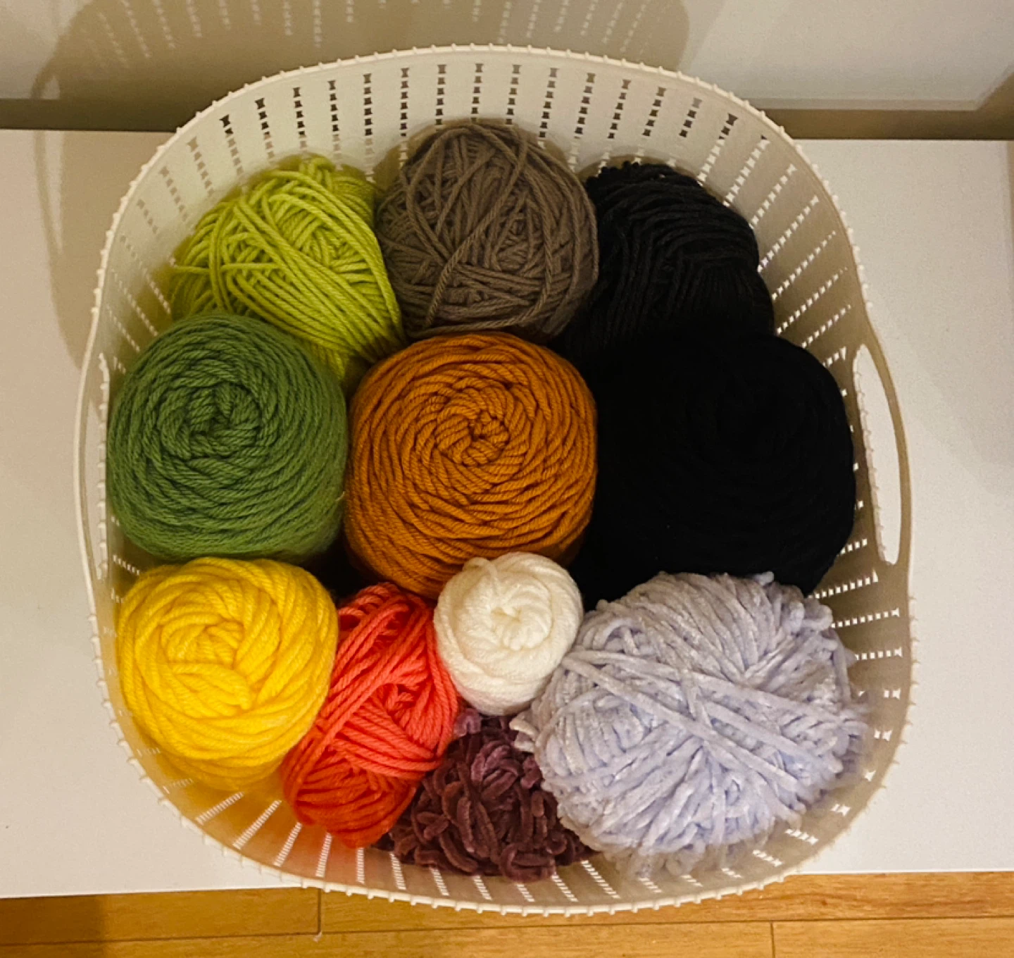 Assorted Yarn Skeins, Polyfill, and Large Crochet Hook