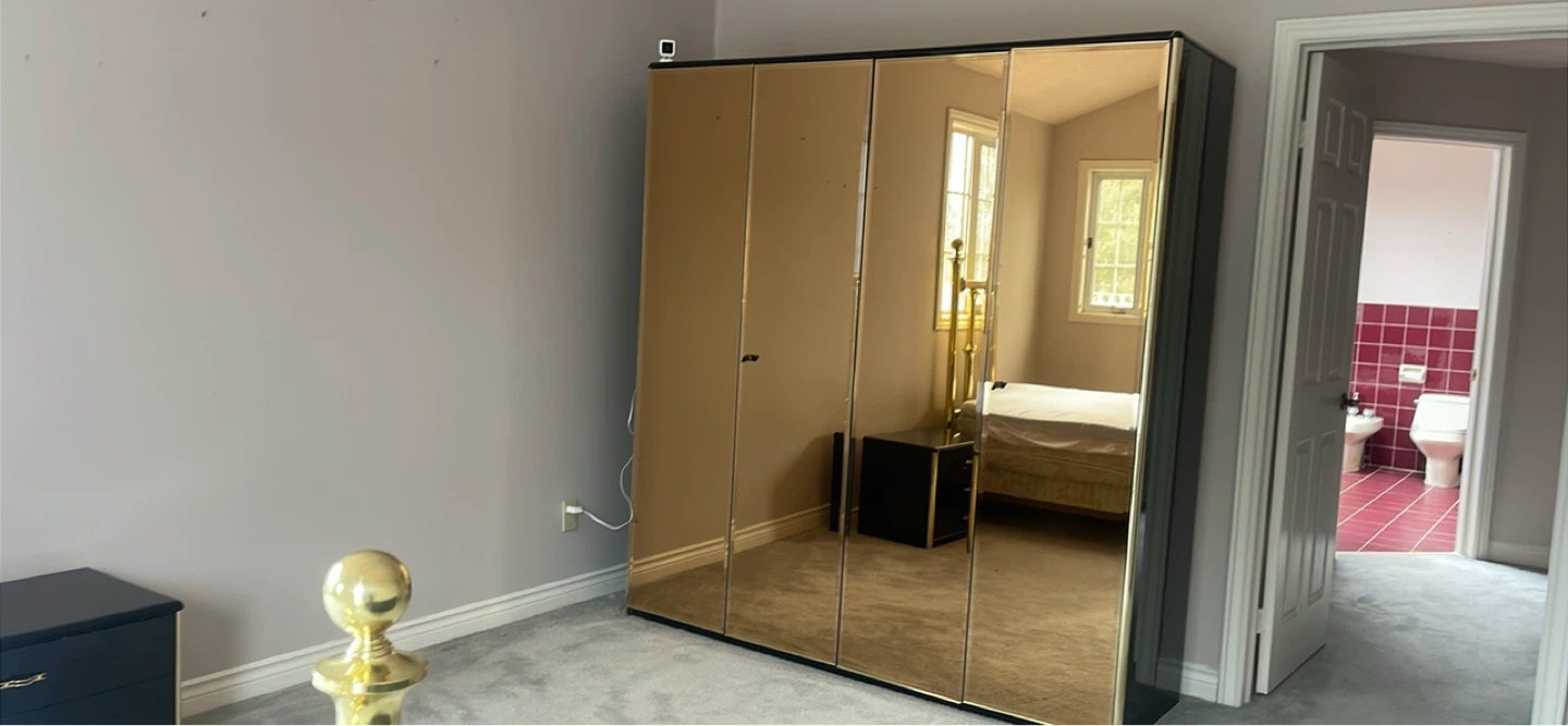 Mirrored wardrobe with drawers