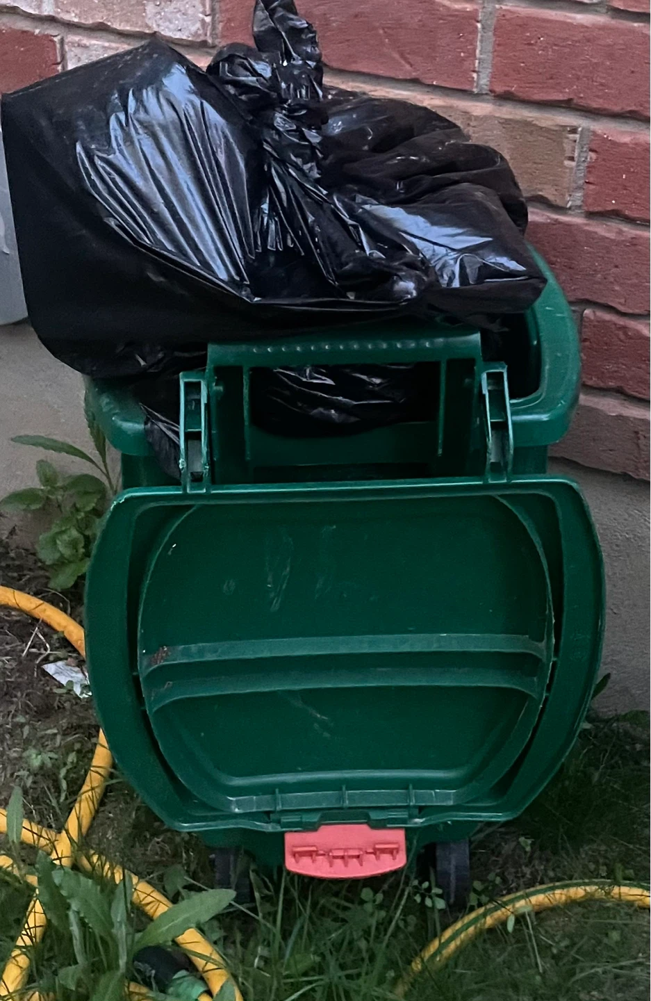 Green Wheeled Trash Bin with Lid