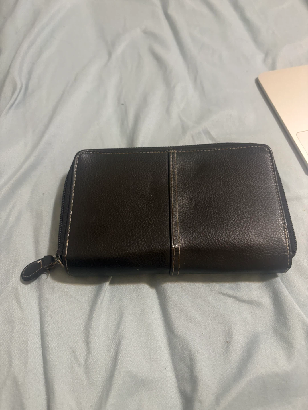 Black zip-around wallet with built-in calculator