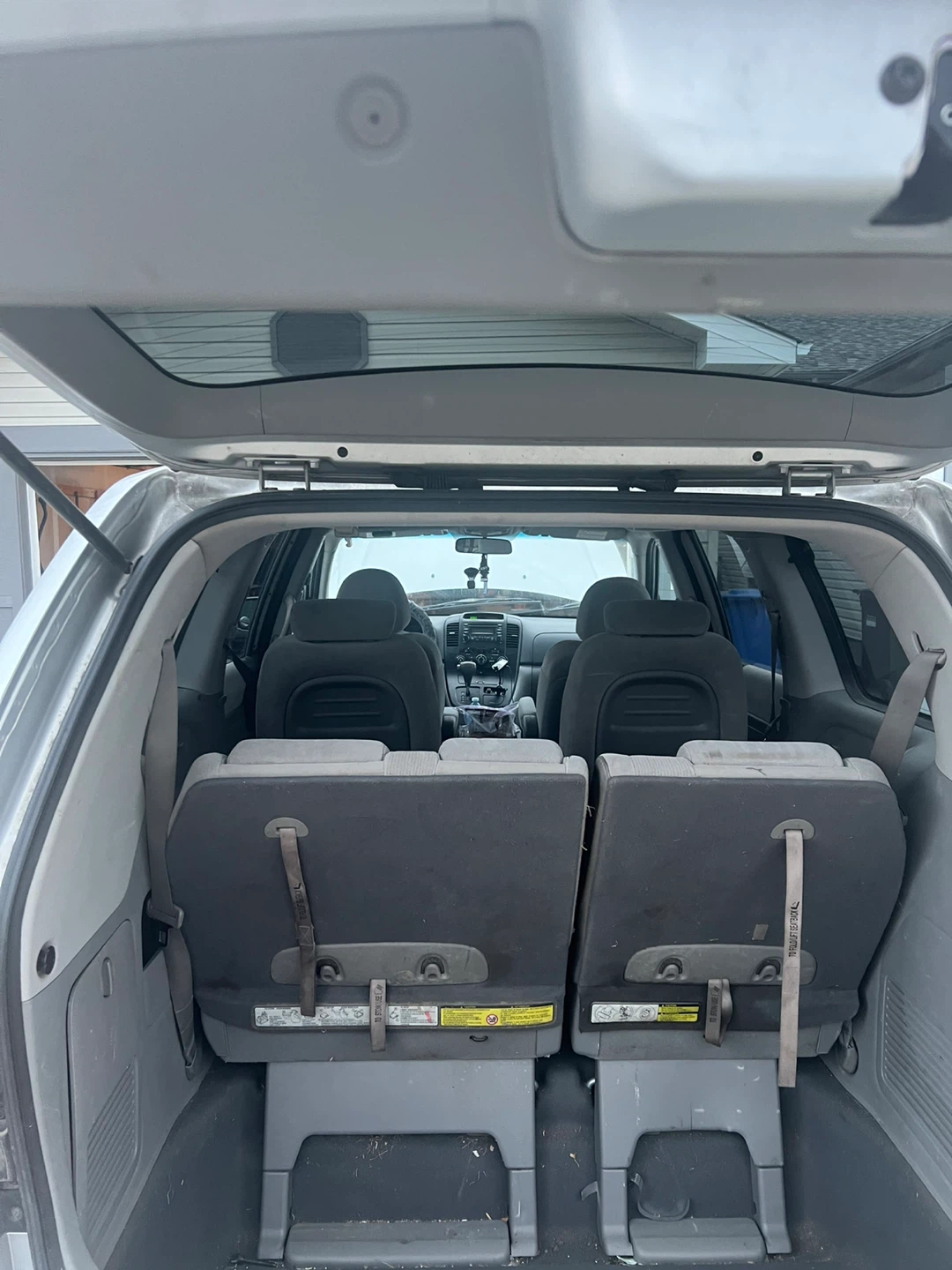 Silver Kia Sedona Van