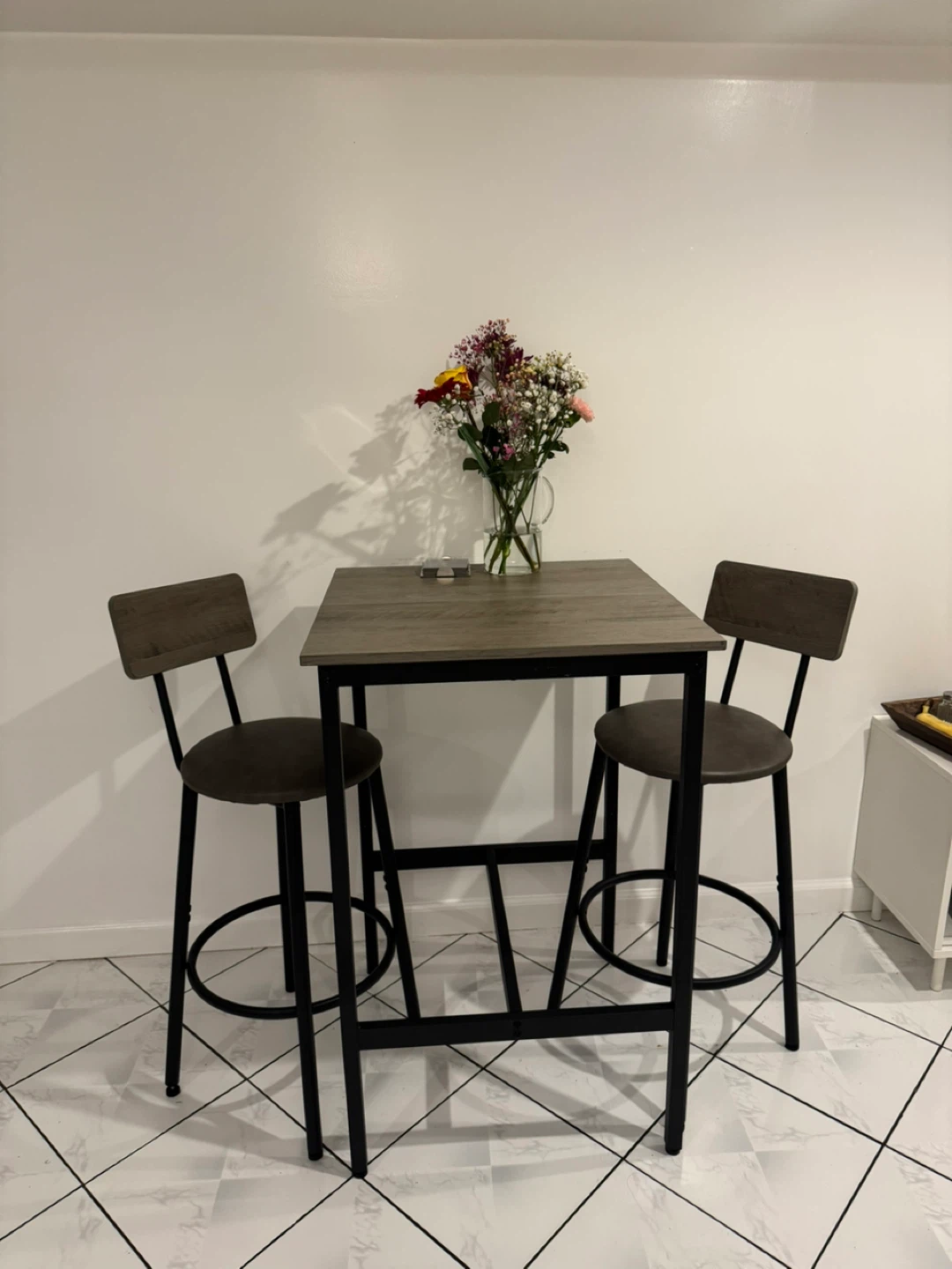 Bar height dining set with square table and 2 cushioned stools. - photo 2