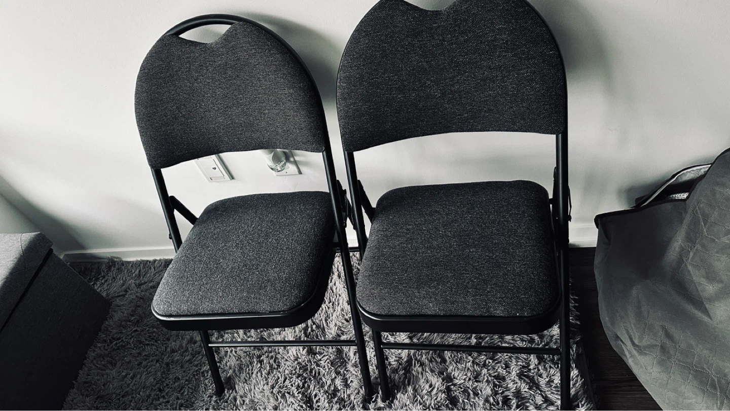 Two Grey Folding Chairs