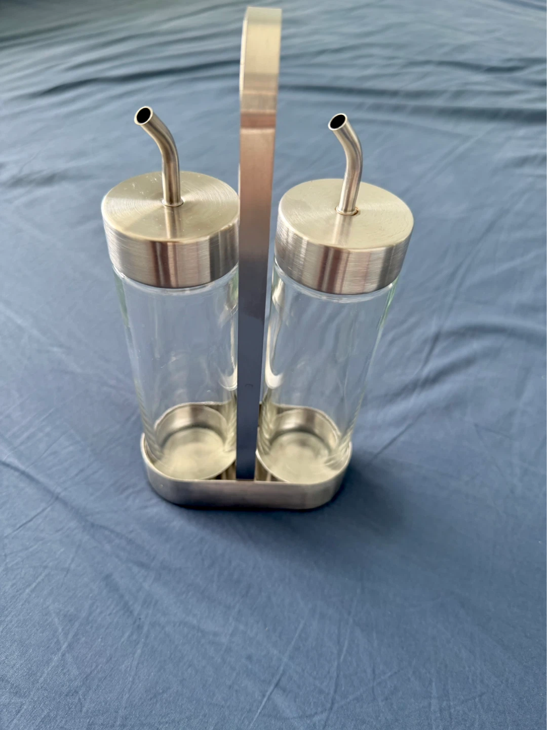 Glass cruet set with metal caddy