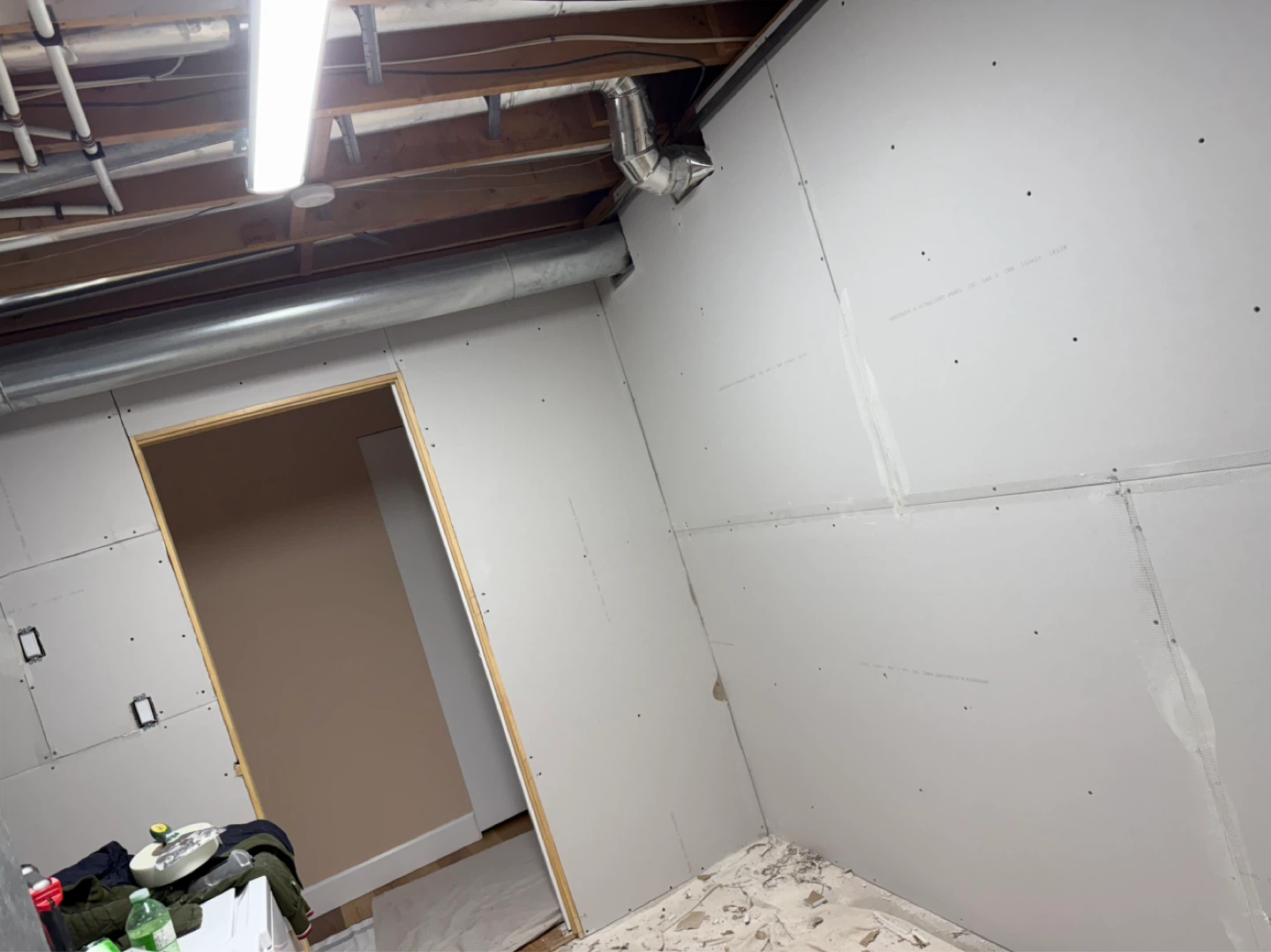 Unfinished Basement Wall with Drywall and Framing - photo 3