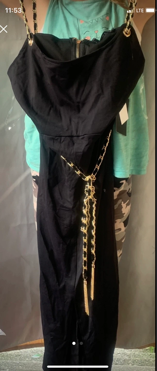 Black dress with gold chain straps and tassel belt