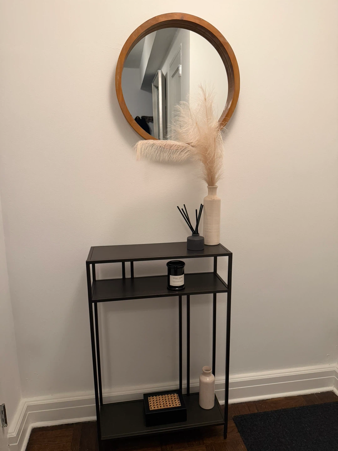 Black metal console table with two shelves